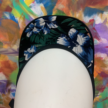 Load image into Gallery viewer, black hat with a blue Hawaiian flower design under the cap.